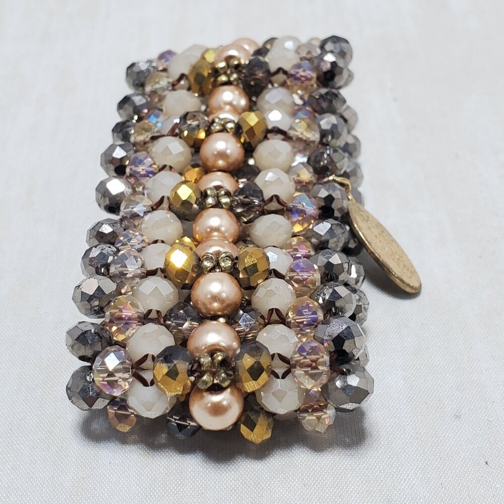 Ali Khan stretch bracelet color of pink, white, gold, and silver. gift box